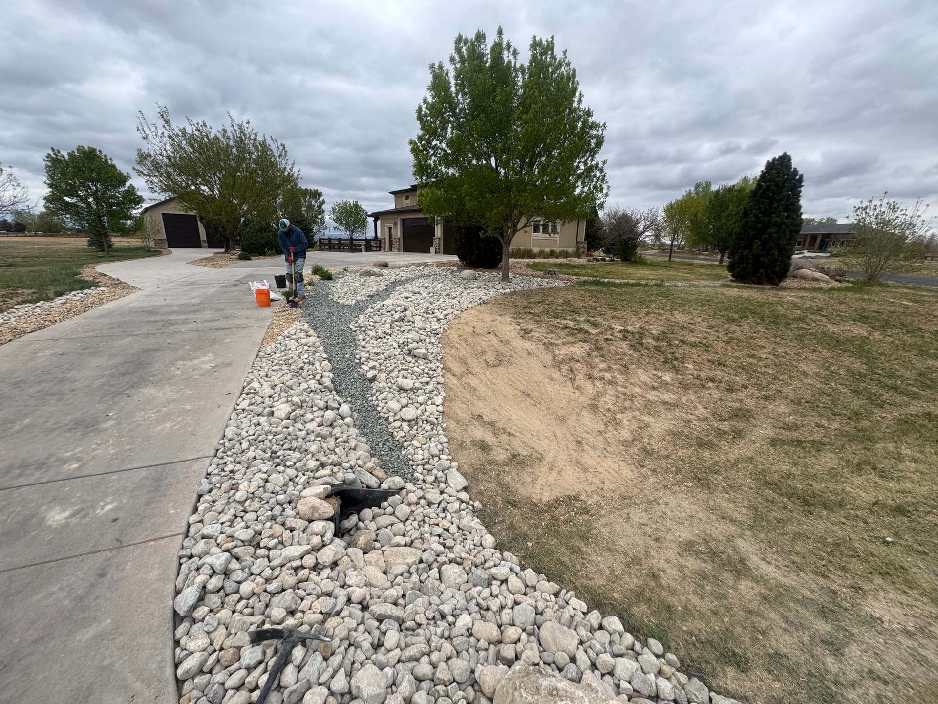 Gallery photos for 15 Tons of Cobble Turned a Bare Dirt Area Into a Rock Garden: Image #1