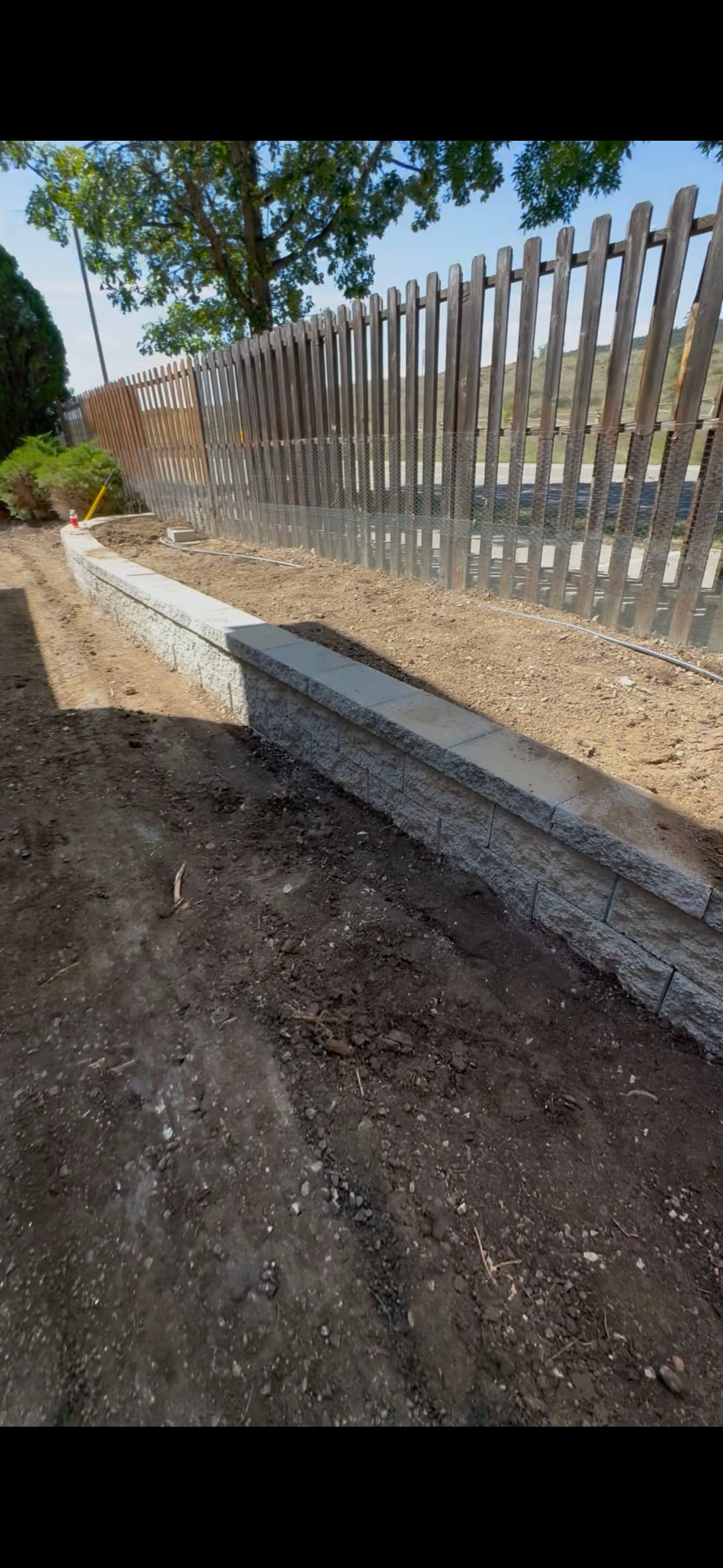Project Regrading, Drainage, Retaining Wall and Fence Replacement to Stop Foundation Water Damage image