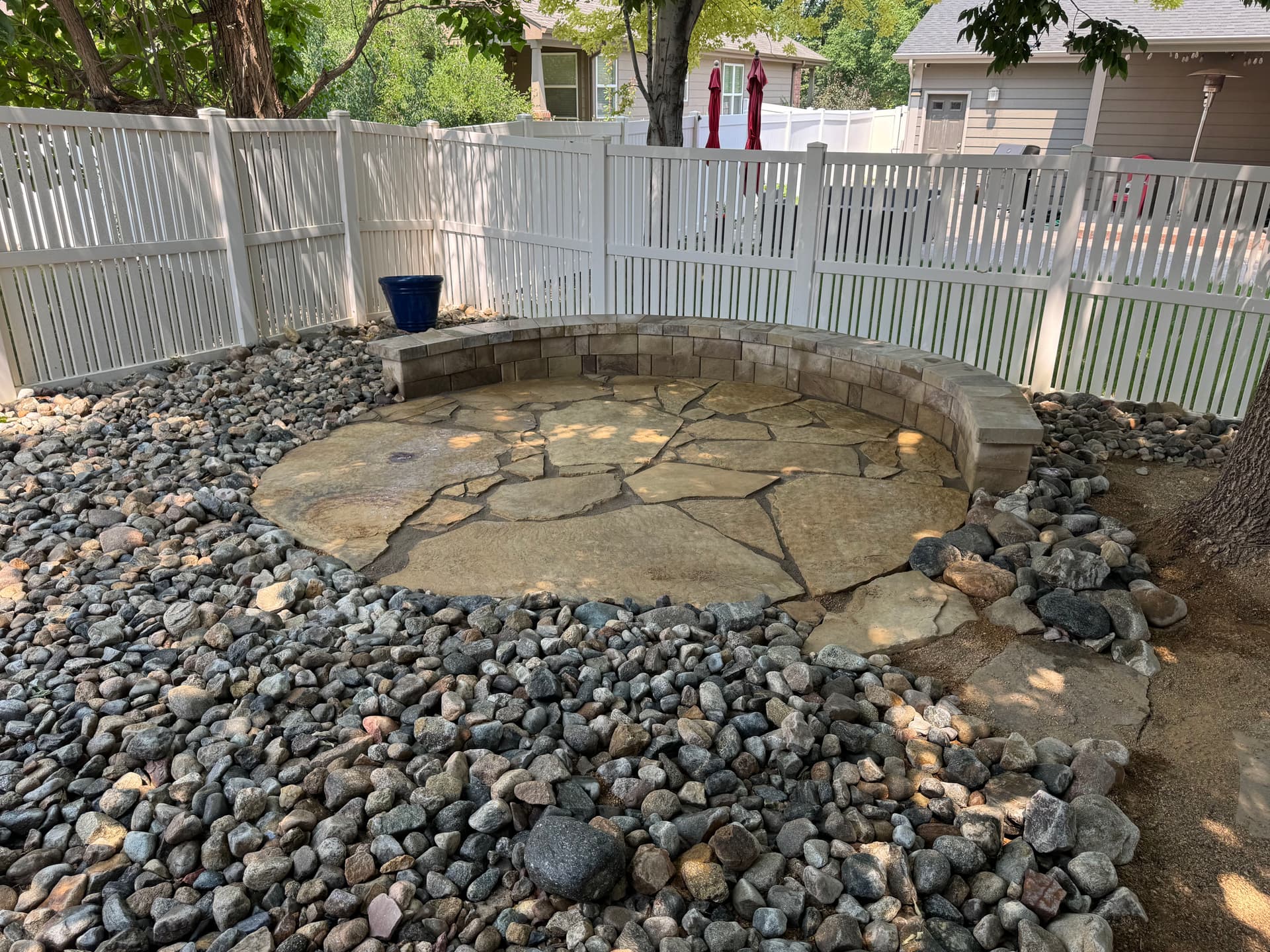 Low-Maintenance Xeriscape with Flagstone Patio and Seating Wall image