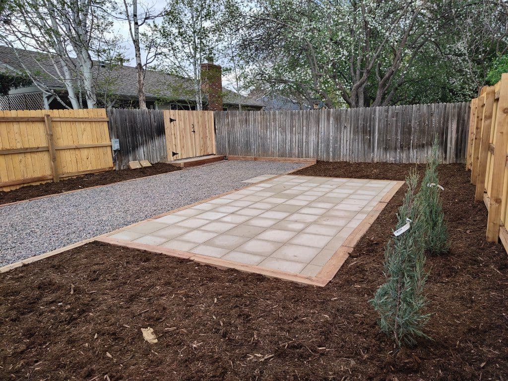 Backyard Transformation with Paver Patios and Wooden Gates