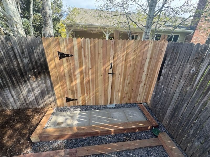 Backyard Transformation with Paver Patios and Wooden Gates